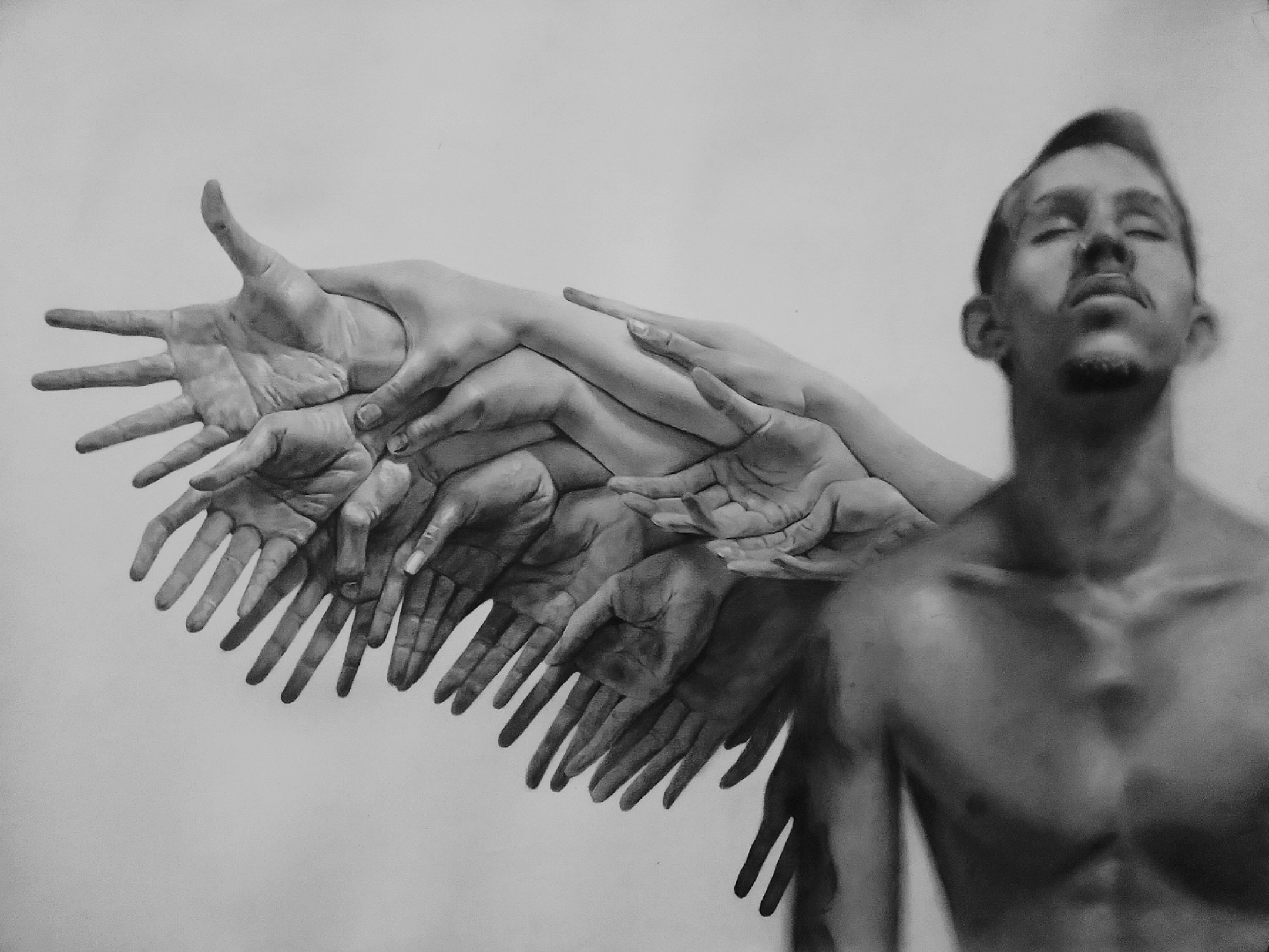 In the image, a shirtless man appears on the right side, slightly out of focus, with his eyes closed and an expression of introspection or calm. To his left, a cluster of hands fans outward, overlapping in various directions. The hands, open and extended, form a shape resembling wings or a dynamic fan, suggesting movement or symbolic expansion. The contrast between the solitary figure and the multitude of hands evokes a tension between internal reflection and external projection. This imagery speaks to themes of liberation, support, and spiritual connection, characteristic of the visual narratives explored in Cuban contemporary art. Here, the human body becomes a medium to convey transformation, identity, and collective experience, central elements of this artistic tradition.